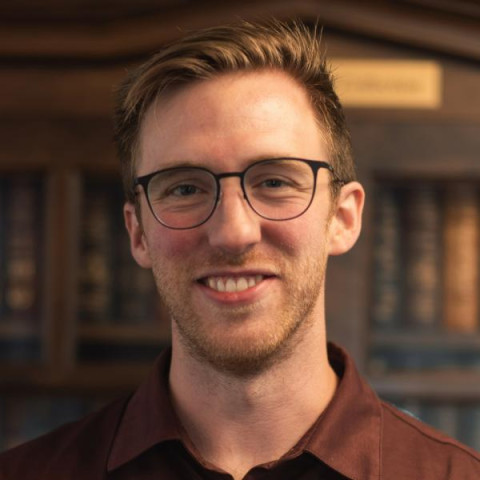 Male doctor with light hair and glasses