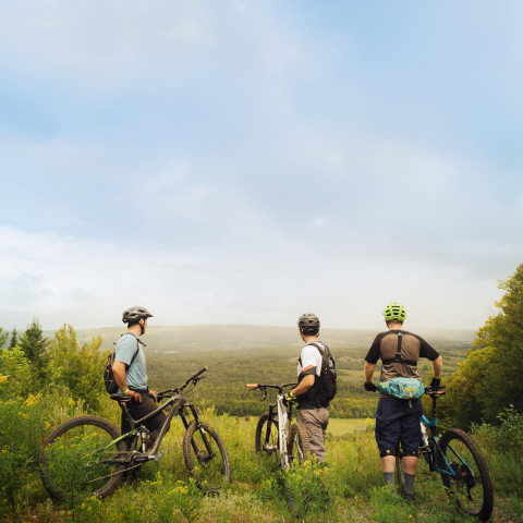 people on bicycles overlooking the town of Antigonish
